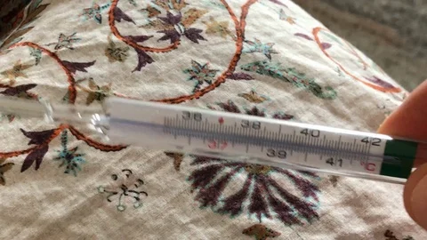 Close up of a person while measuring fever 스톡 동영상 108220675