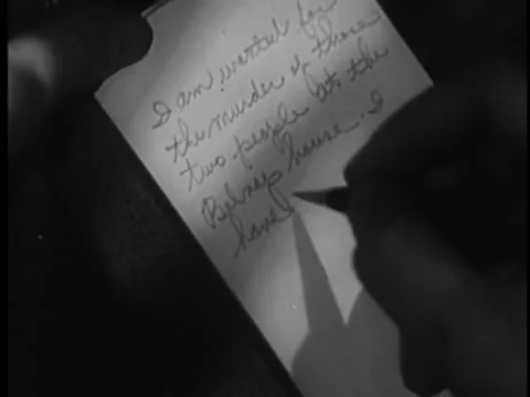 Close-up of person writing a message on notepad Stock Footage 260256753
