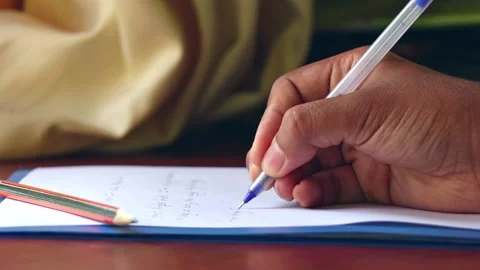 Close Up Of a Person Writing On a Paper Video stock 170154434