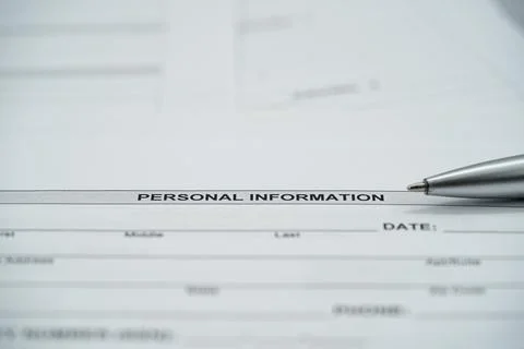 Close up of personal information section on application form with pen Stockfoto's