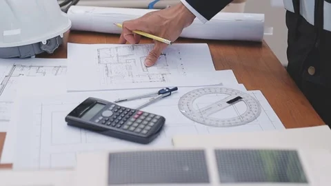 Close-up Of Person's engineer Hand Drawing Plan On Blue Print with architec.. Stock Footage 345608164