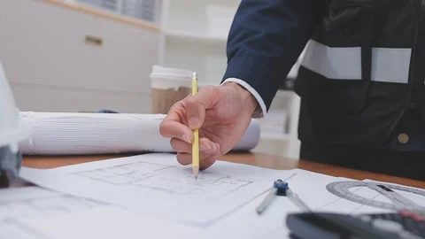 Close-up Of Person's engineer Hand Drawing Plan On Blue Print with architec.. Stock Footage 345608171