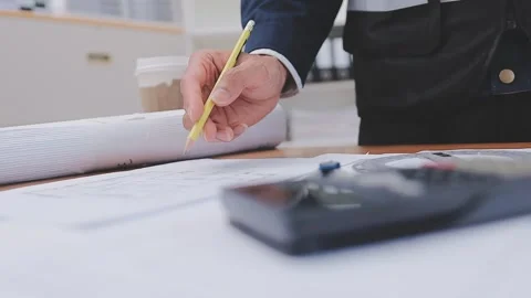 Close-up Of Person's engineer Hand Drawing Plan On Blue Print with architec.. Stock Footage 345608192