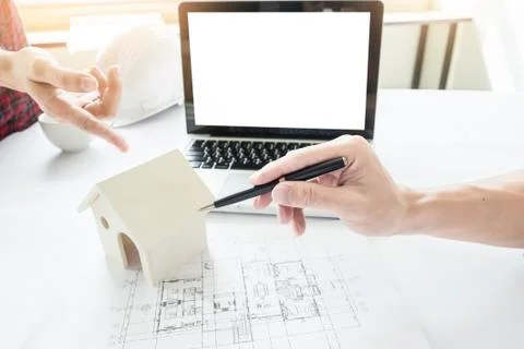 Close-up Of Person's engineer Hand Drawing Plan On Blue Print Fotos de archivo