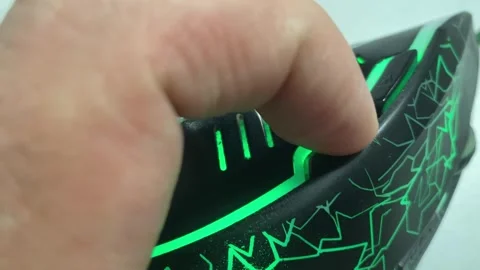 A close-up of a person's finger pressing an auxiliary button on a futuristi.. Stock Footage 323000863