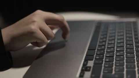 Close-up of a person's finger using a laptop touchpad for navigation and control Stock Footage 339173638