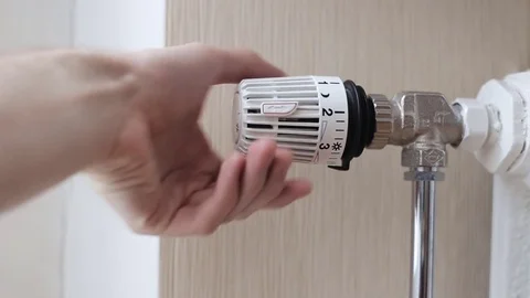 Close-up Of A Person's Hand Adjusting Temperature Of Radiator Thermostat Stock Footage 71049853
