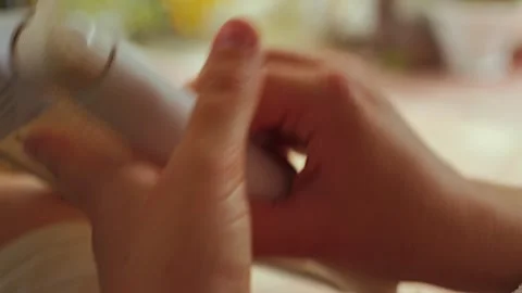 A close-up of a persons hand delicately working on an embroidery project Stock Footage 313452200