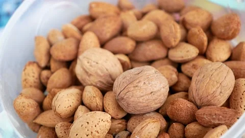 Close-up of a person's hand dry shelled almonds,shelled almonds, Stock Footage 167136937