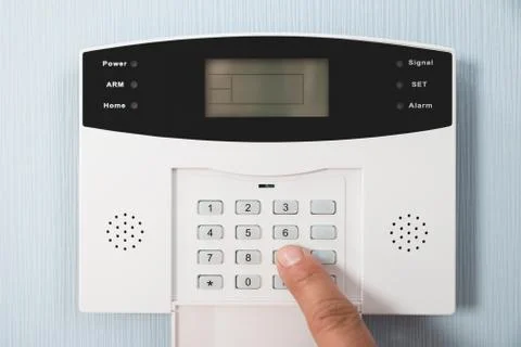 Close-up Of A Person's Hand Entering Code In Security System Foto stock