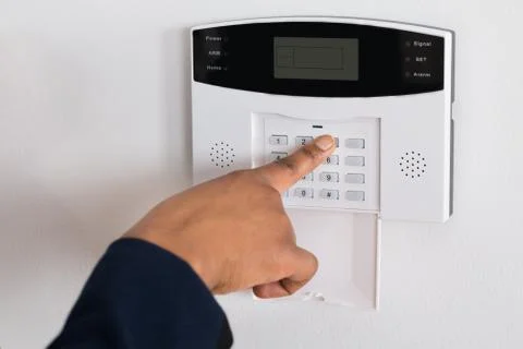 Close-up Of A Person's Hand Entering Code In Security System Stock Photos