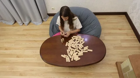 Close-up of a person's hand moving a chess piece on a wooden board Stock Footage 278886232