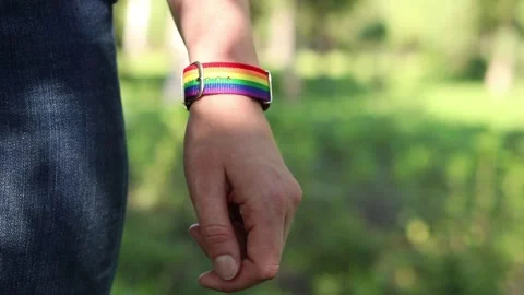 Close-up of a person's hand with a rainbow bracelet Vídeo Stock 341020489