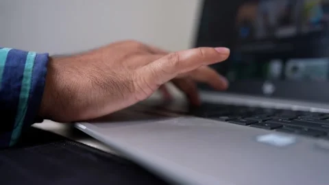 Close-up of a person's hand typing on a laptop keyboard Stock Footage 317131713