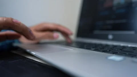 Close-up of a person's hand typing on a laptop keyboard Stock Footage 317131720
