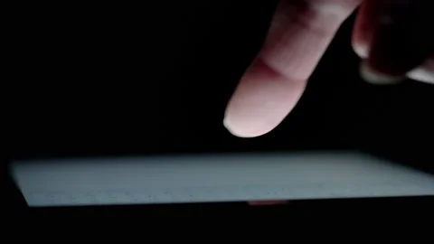 Close up of a persons hand - using a tablet touchscreen 01. 4K locked tripod Stock Footage 158044352