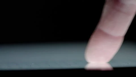 Close up of a persons hand - using a tablet touchscreen 02. 4K locked tripod Video stock 158045414