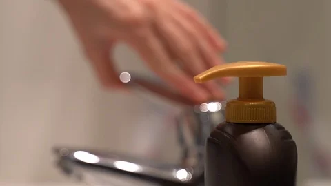 Close-up of person's hands opening water faucet and washing hands with soap Stock Footage 123103191