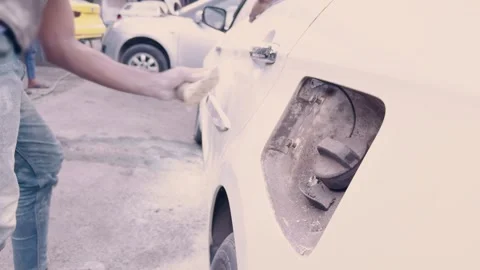 Close up of a persons hands sanding a car door in preparation for painting .. Stock Footage 262020285