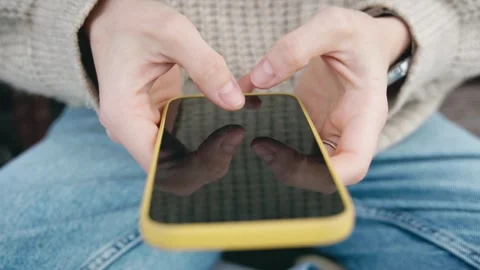 Close-up of a person's hands typing a message on a smartphone Stock Footage 269653286