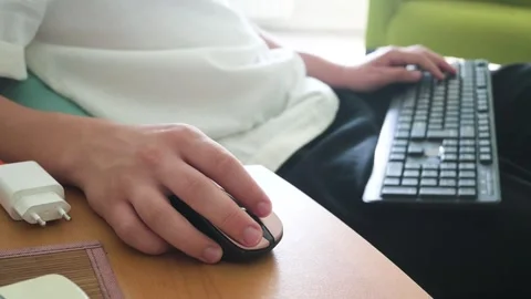 Close-up of Person's Hands Using Wireless Mouse and Keyboard While Working 스톡 동영상 333556341