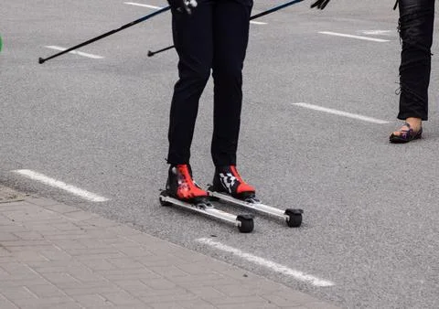 Close-up of person's legs wearing inline roller skates Stock Photos