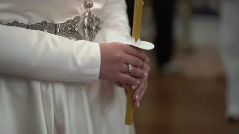 Close Perspective Of Bride Clutching Candle, Intimate View Of Bride With Lit Stock Footage 323774227