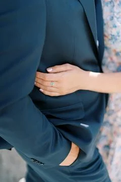 Close Perspective On Hand Displaying Ring And Textured Clothing Symbolizing 스톡 사진