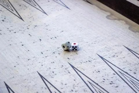 Close-up perspective shoot of dices on backgammon under open light Stock-Fotos