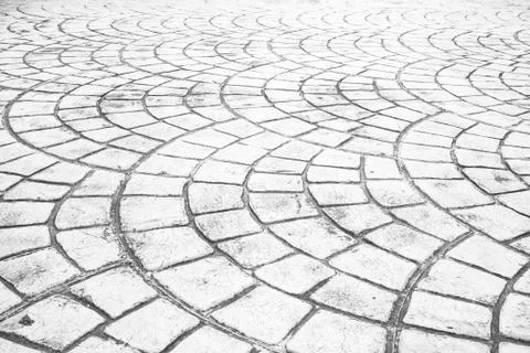 Close up perspective of stone pavement. Stone pavement texture. Granite cobbl Stock Photos