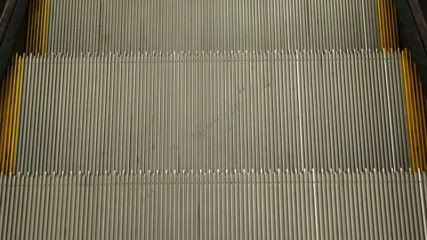 Close-up perspective view looking down an empty escalator, Stock Footage 323325149