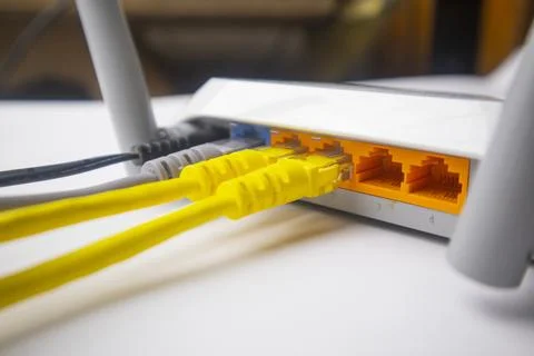 Close-up perspective of a white wireless router's rear interface with multi.. Stock Photos