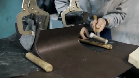 Close up pf a tinsmith blacksmith hands use hammer working in his workshop Stock Footage 152647355