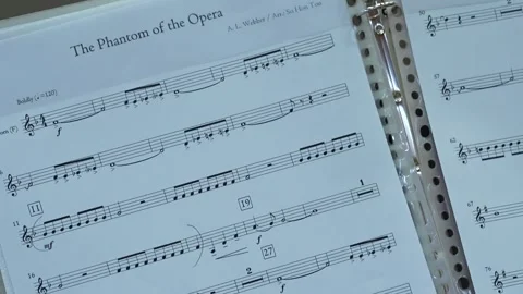 Close-up of Phantom of the Opera sheet music for Horn Video stock 339158722