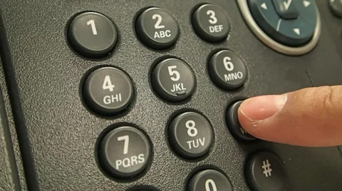 A close up of a phone and a hand calling the emergency number 999 Stock Footage 34386521