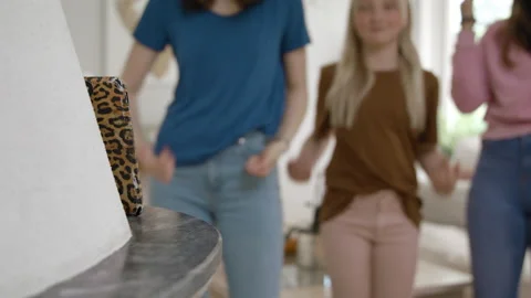 Close up of phone and three out of focus girls recording a TikTok video Video stock 132014824