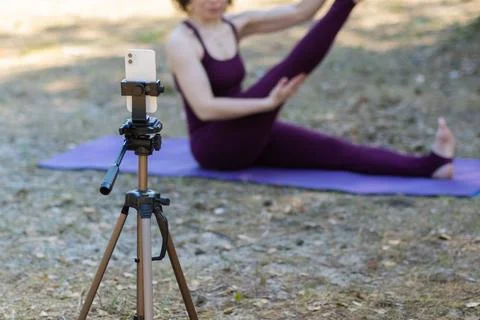 Close-up of a phone while doing yoga Stock Photos