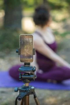 Close-up of a phone while doing yoga Stock Photos