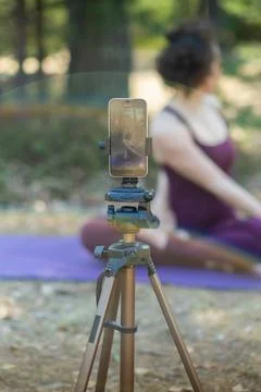 Close-up of a phone while doing yoga Stock Photos