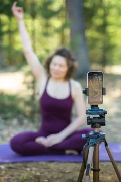Close-up of a phone while doing yoga Stock Photos