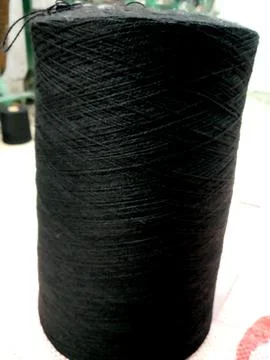 Close up photo of black threads in cones on the knitting machines 库存照片