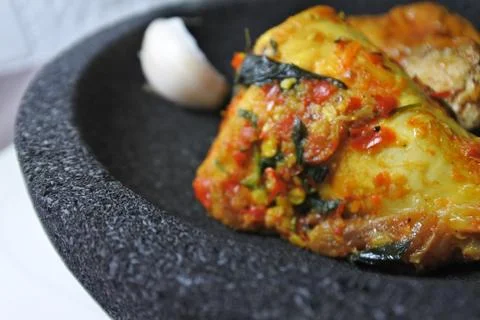Close up photo of a grilled chicken on a stone plate Stock Photos
