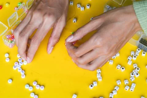 Close-Up Photo of Multiple Colored Beads With a Pair of Needle Nose Pliers Stock Photos