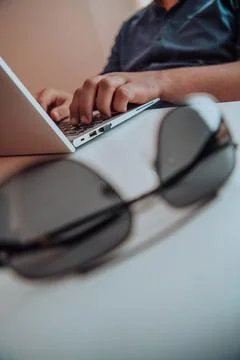 Close-up photo of a programmer typing on a laptop Foto stock