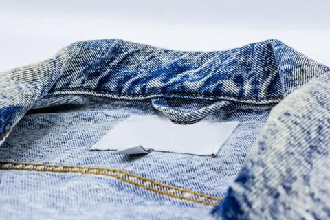 Close-up photo of several elements of a beautiful and fashionable denim jacket. Fotos de archivo