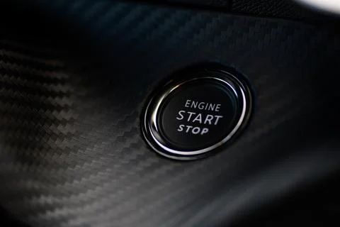 Close-up photo of the start stop button on the dashboard of a 2024 Peugeot .. Stock Photos