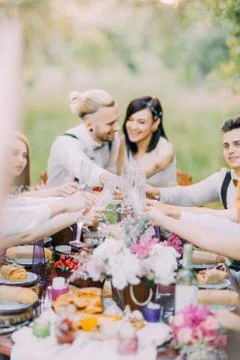 The close-up photo of the table setting and the glasses at the background of the Stock Photos