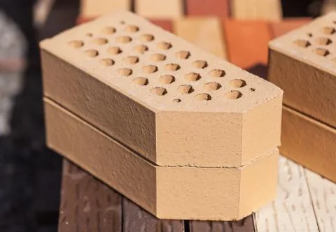 Close-up photo of two beige cladding bricks Stock Photos