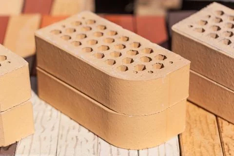 Close-up photo of two beige cladding bricks Stock Photos