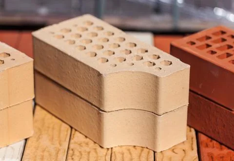 Close-up photo of two beige cladding bricks Stock Photos
